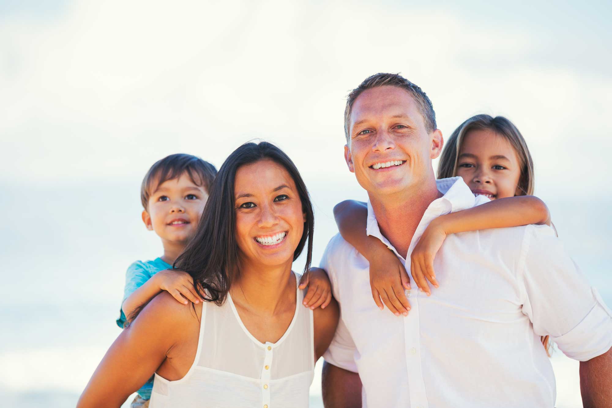 happy-mixed-race-family-having-fun-outdoors